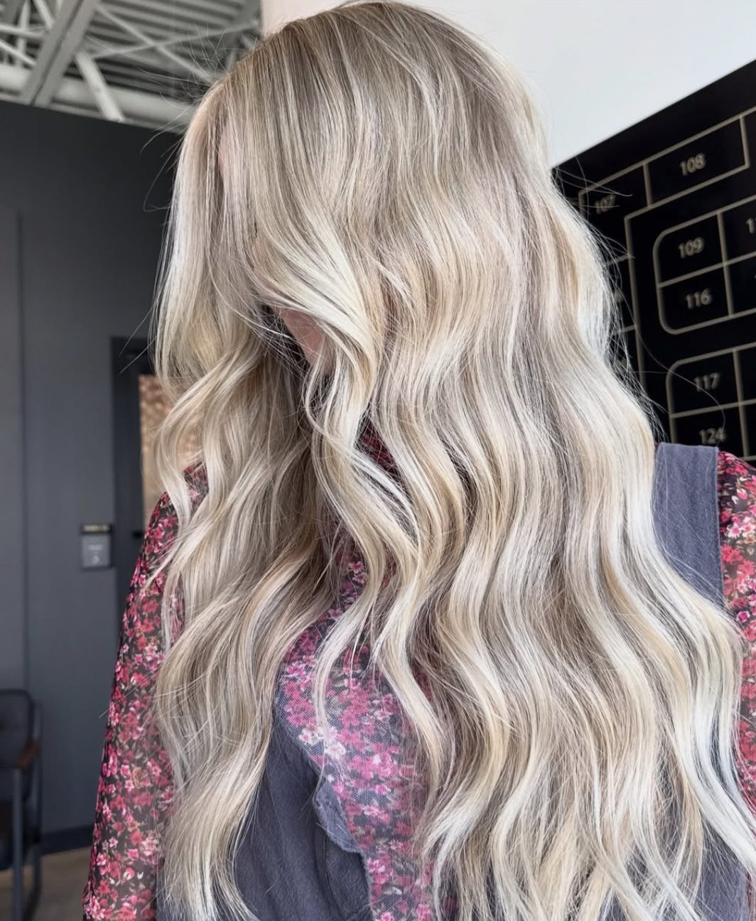 Lived-in blonde balayage with soft waves